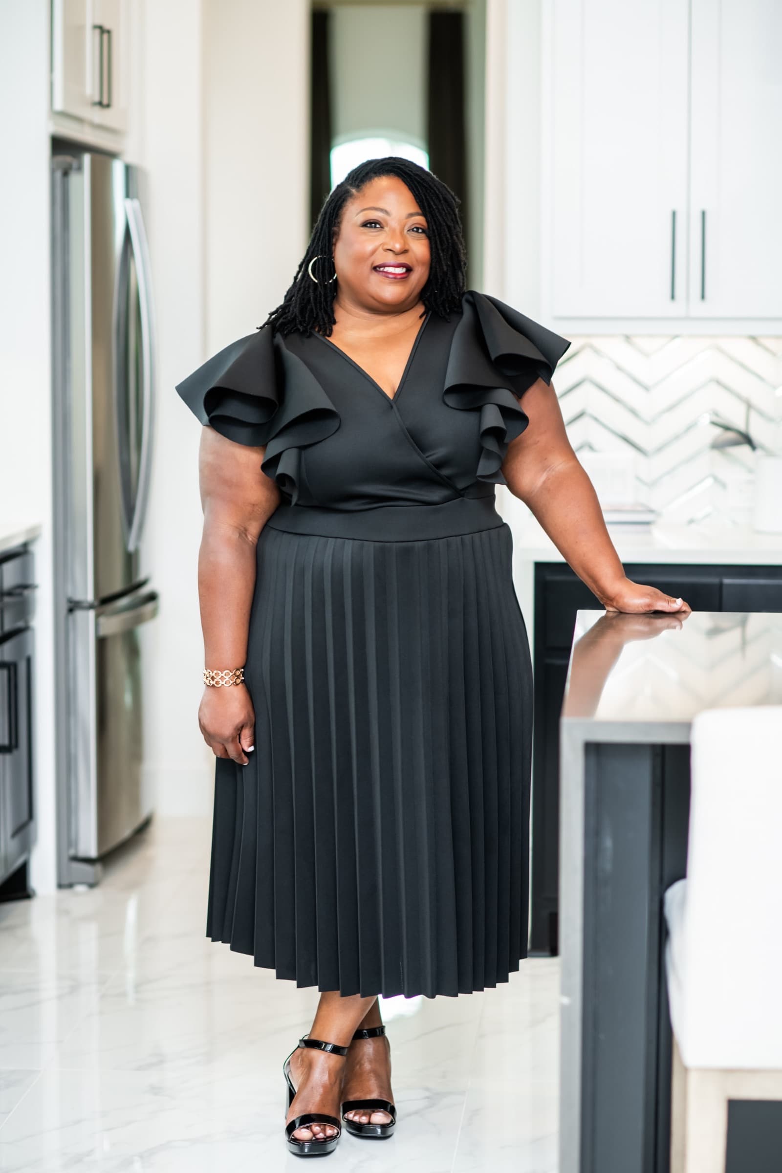 Angela Stagg standing in a modern kitchen
